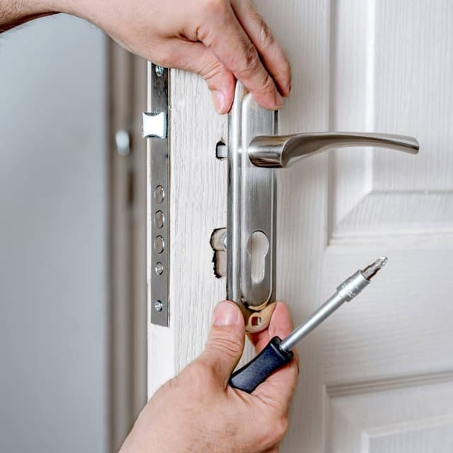 Professional locksmith at work